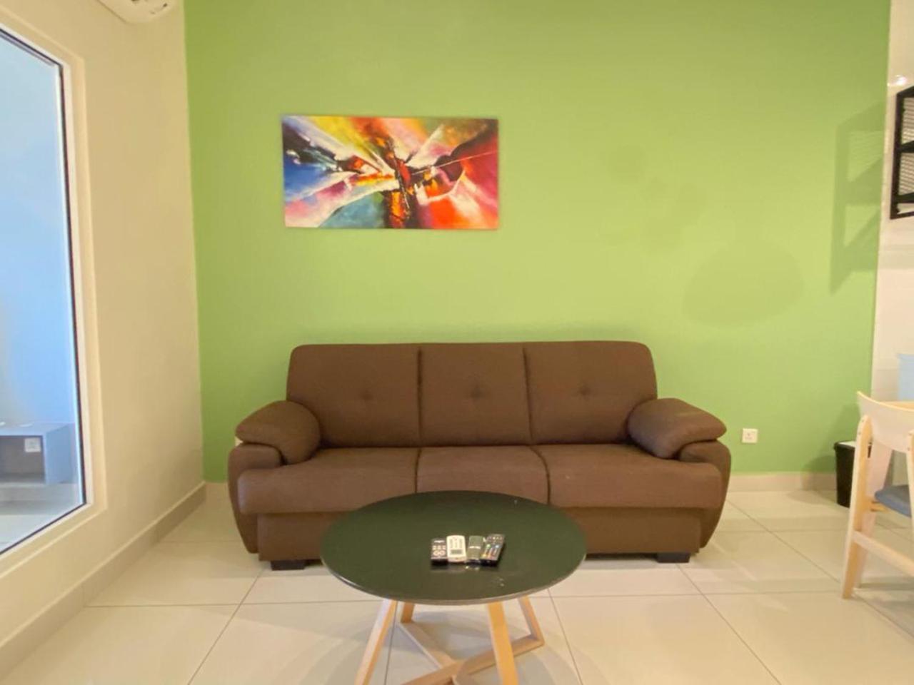 Arte Mont Kiara Aparthotel Kuala Lumpur Exteriör bild A living room with a sofa